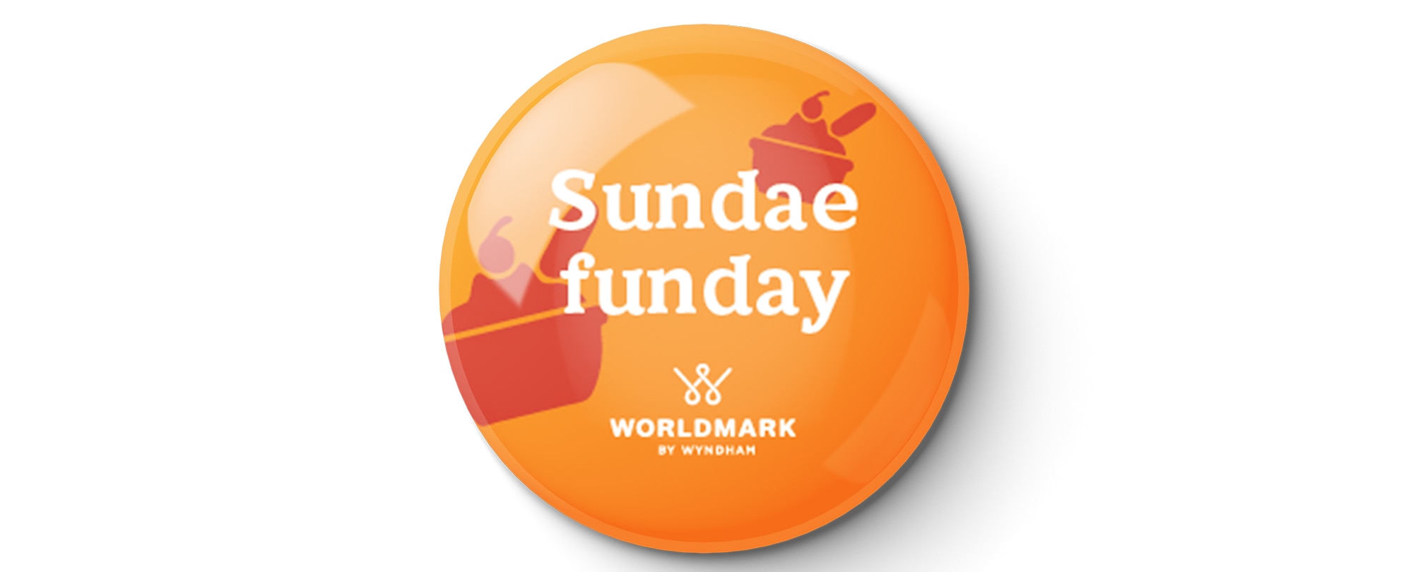 An orange "Sunday Funday" WorldMark by Wyndham pin 